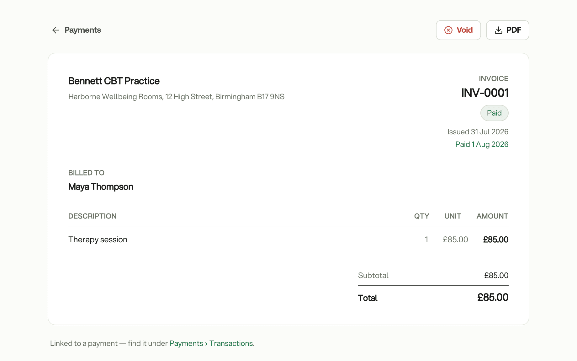 A paid invoice in the practice's name: INV-0001, one therapy session, £85.00